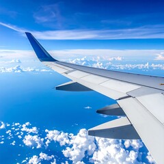 Obraz premium Airplane wing over clouds