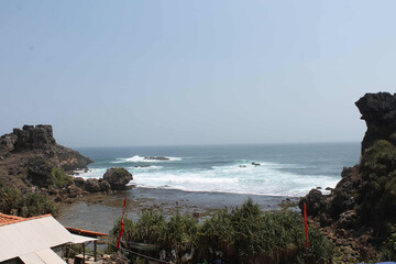 Scenic Views of Nglambor Beach Coastal Beauty and Serene Waters on a Sunny Day