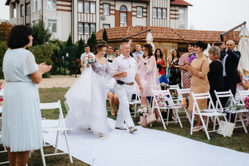 wedding ceremony of the newlyweds on the glade © omelnickiy