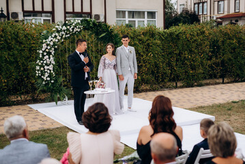 wedding ceremony of the newlyweds on the glade © omelnickiy