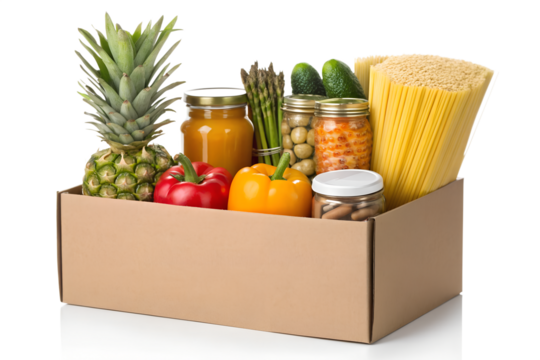A generous food donation box overflowing with a variety of fresh groceries like vegetables, fruit, pasta, and jarred goods, isolated on a white background
