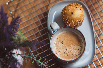 Coffee with cookie in lavender arrangement, Cup of coffee served with cookie in elegant lavender arrangement. Time for coffee, Coffee and baked pastry breakfast. Fresh baking treat