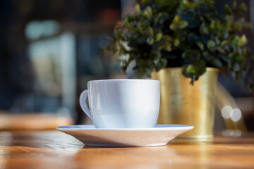 A table in a cafe against the backdrop of a city landscape