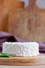 Camambert cheese on cutting board