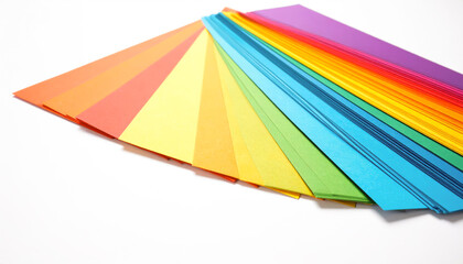 A vibrant fan of multicolored paper strips arranged in a beautiful rainbow spectrum on a clean white background