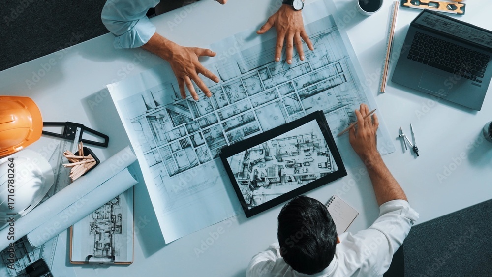 Poster top view of civil engineer working together to plan building design. top down aerial view of skilled