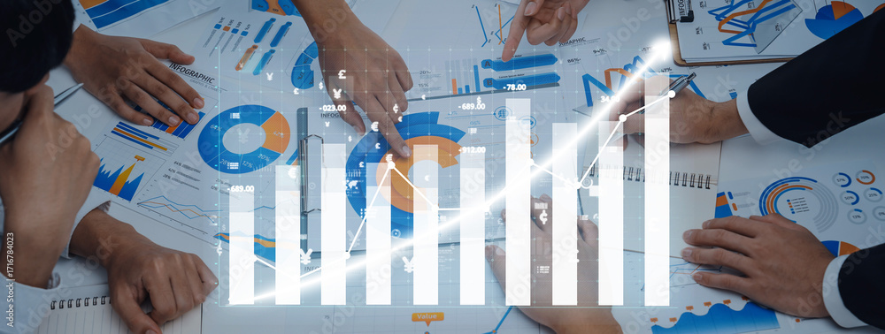 Poster diverse business team collaborates on financial strategies, analyzing graphs and charts, pointing at