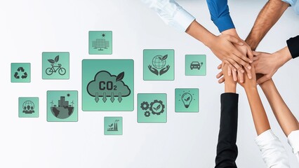 Hands come together to symbolize teamwork in addressing carbon emissions, surrounded by eco-friendly icons, showcasing a commitment to sustainability and environmental responsibility. Raster
