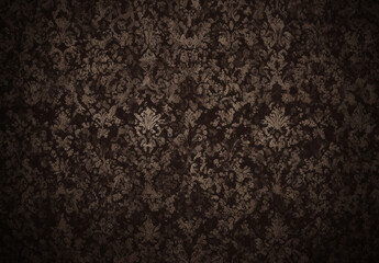 Dark brown vintage wallpaper with a subtle, faded damask pattern creating a textured, grungy background.