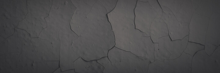 Dark wide panoramic background. Peeling paint on a concrete wall. Faded dark texture of old cracked flaking paint. Weathered rough painted surface with patterns of cracks. Shaded background for design