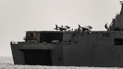 The deck of the Spanish Navy aircraft carrier Juan Carlos I, with two Harrier vertical takeoff...