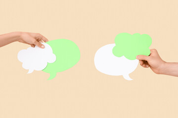 Different hands with speech bubbles on beige background