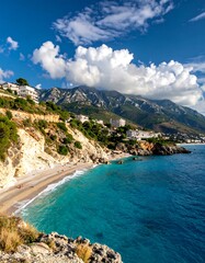 Coastal landscape with beach and mountains