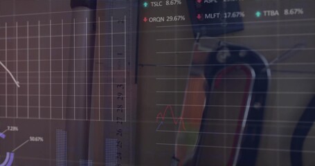 Showing carabiner pair hanging from studio pegboard with orange sling, data overlay, copy space