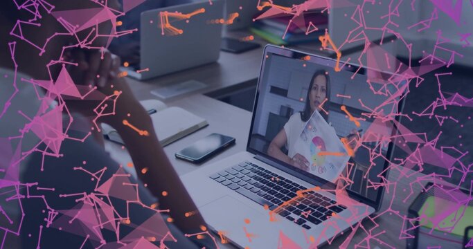 Showing woman in blouse holding pie chart on laptop at desk, with network overlay, copy space - Powered by Adobe