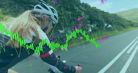 Riding cyclist wearing helmet monitoring computer on mountain road, with neon-green charts overlay