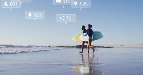 Sprinting surfers in rash guard and shorts carrying boards at beach, with social icons, copy space