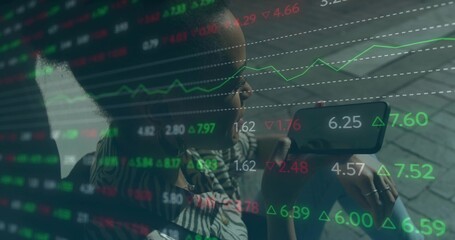 Holding smartphone close to face, woman in striped blouse analyzing stock data overlay on pavement
