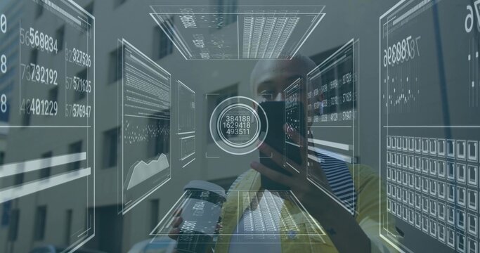 Examining tech analyst studying holographic data panels in office, holding smartphone and booklet