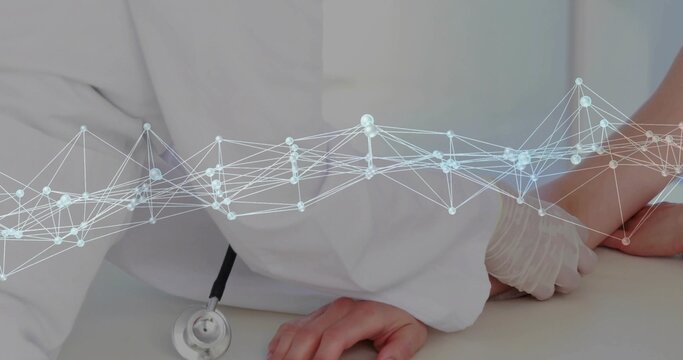 Examining medical doctor wearing latex glove holding foot and ankle in exam room, with mesh overlay