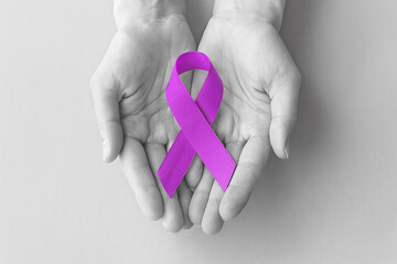 Hands Holding Purple Ribbon for Cancer Awareness Campaign World Cancer Day Post
