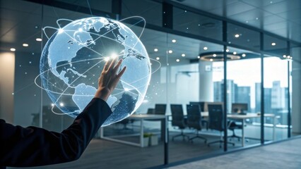 Hand reaching toward glowing holographic digital globe futuristic office setting interactive data visualization contemporary workspace close-up perspective technological innovation