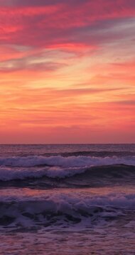 Beautiful ocean beach sunrise and splashing waves on the sea sand, ocean sunset