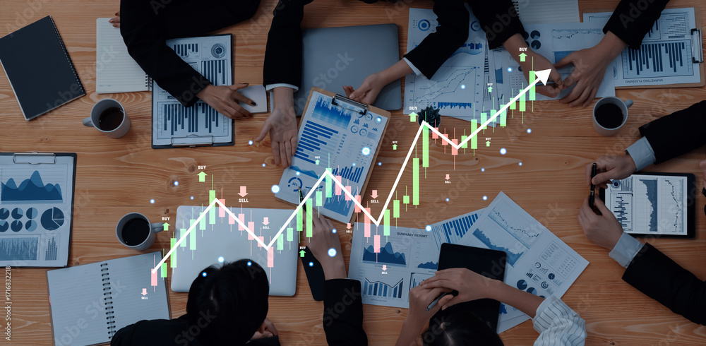 Poster a top-down view of a business meeting focused on data analysis. professionals engage with charts and