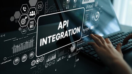 Hands Typing on Keyboard with Overlay Graphics Displaying API Integration and Data Connectivity Concepts in a Modern Office Environment. Asymptotic smart data analytic.