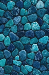 A captivating texture of intricately patterned, teal and dark blue stones arranged in a seamless, natural-looking mosaic.