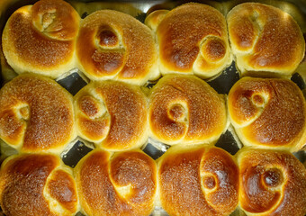 Freshly baked buns on a baking sheet