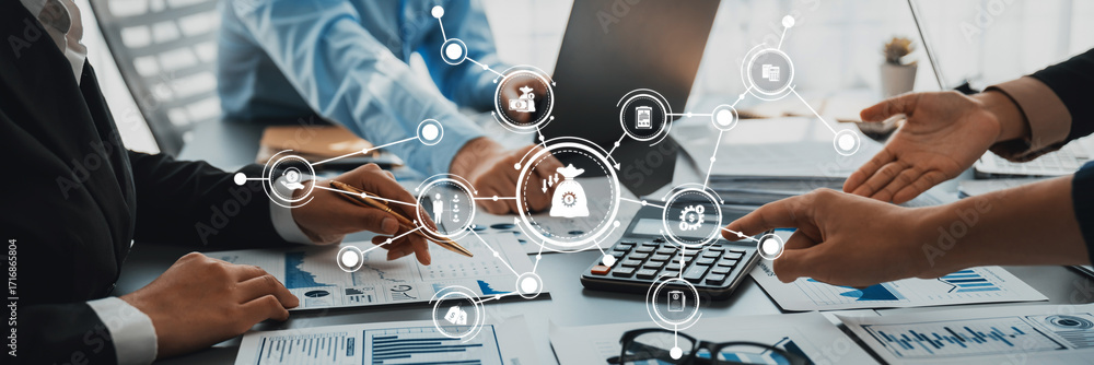 Poster a professional team engaging in financial analysis at a modern office, utilizing digital tools and g
