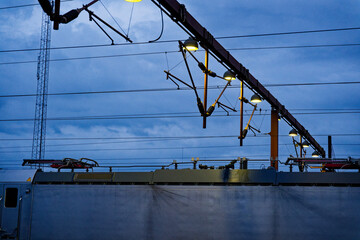 Stationed train beneath the web of overhead power lines