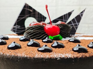 Chocolate Cake CloseUp with Cherries and Chocolate Drizzle Topping.