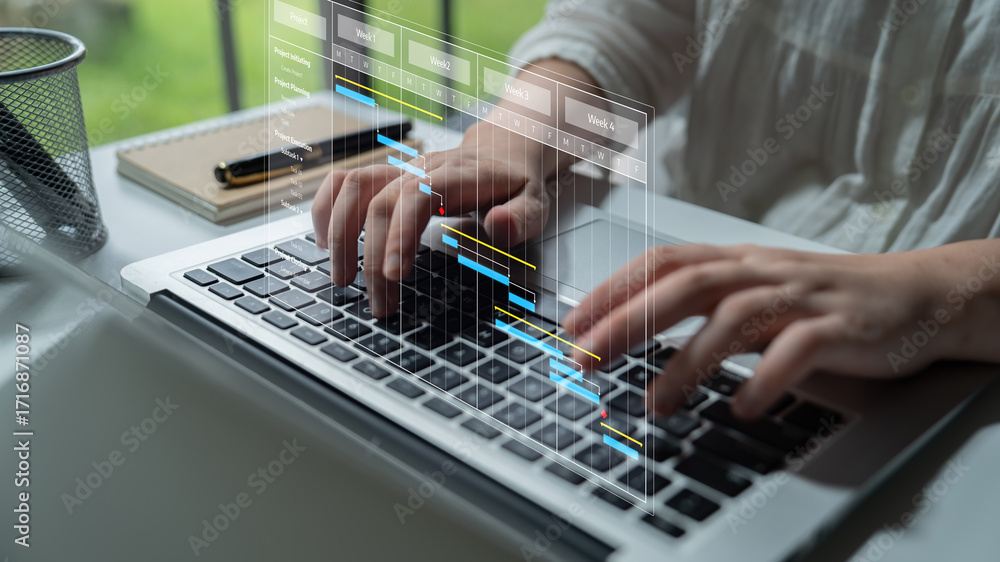 Poster a person engaged in typing on a laptop keyboard, surrounded by a modern office setting, interacting 
