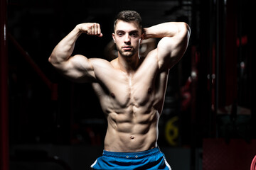 Fototapeta premium Young Man Showing Abdominal Muscle