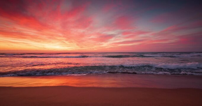 Golden sunrise above tropical beach, scenic ocean sunset over the coastline