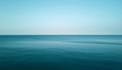Obraz premium Tranquil Teal Ocean Under a Clear Blue Sky