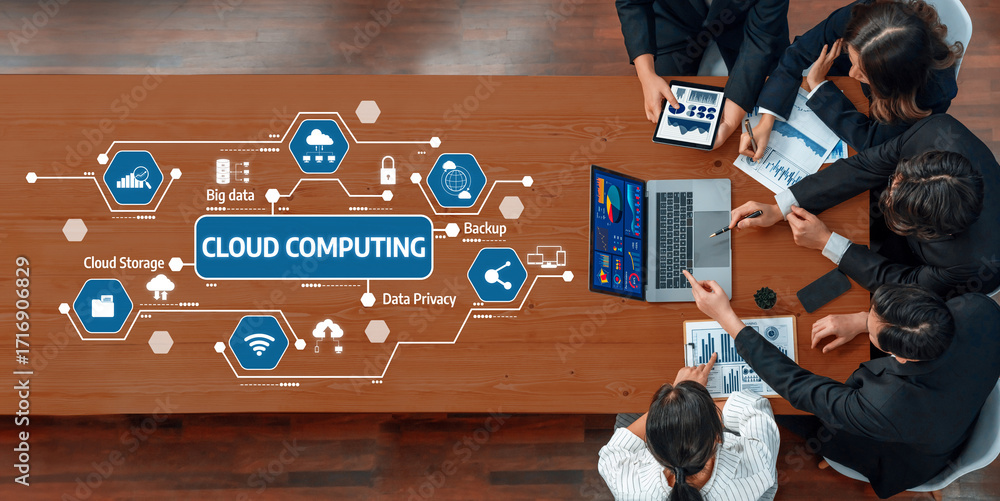 Poster A group of professionals engaged in a meeting focused on cloud computing strategies, utilizing visual data analysis and technology in a modern office environment. Amity