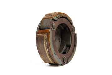 Old rusty metal clutch part isolated on white background, vintage industrial machinery component close up