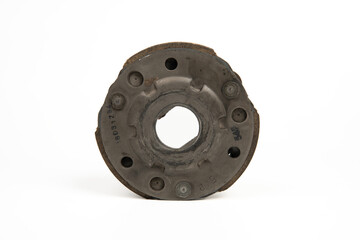 Old rusty metal clutch part isolated on white background, vintage industrial machinery component close up