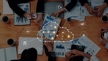 A dynamic business team is engaged in digital data analysis, using cloud technology and visual graphs while collaborating in a modern office for strategic insights and decisions. Raster - Powered by Adobe