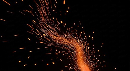 Ignite your designs with this dynamic display of vibrant orange sparks against a stark black backdrop, perfect for adding energy and excitement to your creative projects