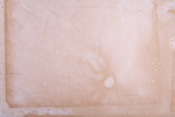 Faded parchment paper with light stains and scratches