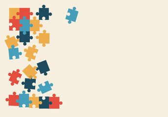 Colorful Puzzle Pieces Scattered on Beige Background.