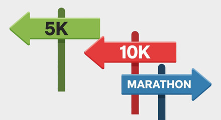 Colorful directional signs indicating distances for running events, 5K, 10K, and marathon.