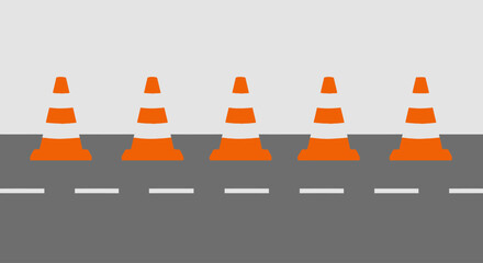 Five orange traffic cones line a road, indicating construction or maintenance.
