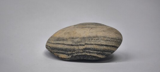 Separated sea pebbles on white background