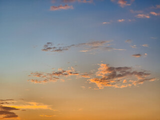 Naklejka premium Beautiful sunset sky background gold gradient color, beautiful afternoon sky after rain in summer season.