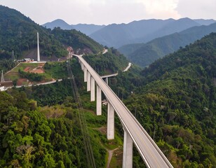Obraz premium High-angle view of a long bridge through a valley